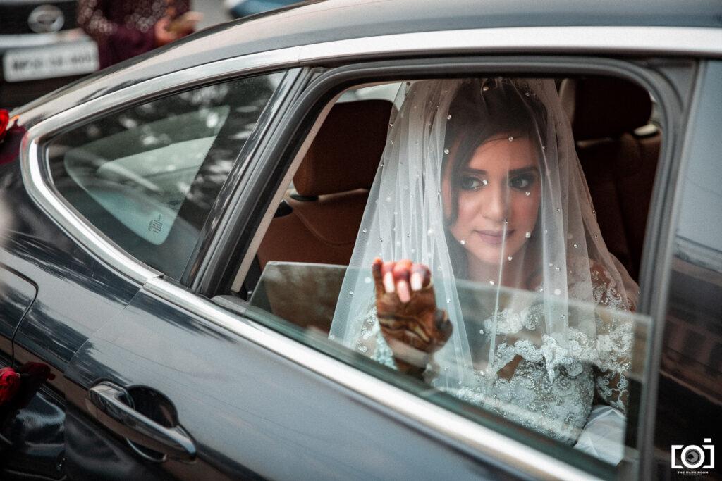 Bride looking from car window